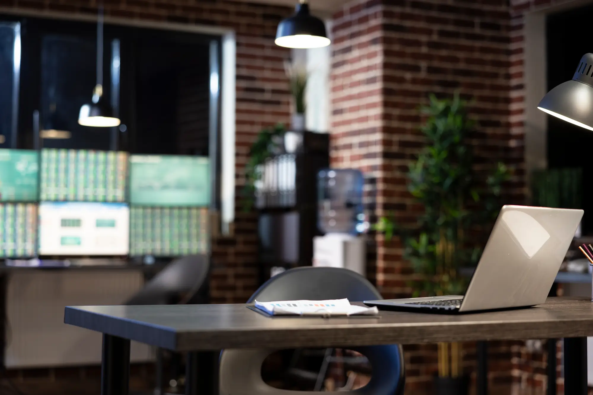 An image of an offcie with a chair and a computer